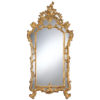 This stylish mirror is hand-crafted in Baroque style from carved wood. Decorative mirror is finished with hand applied gold metal leaf. Design of the mirror features classic dual frame with scrolled leaf and flowers motif. This mirror is hand-crafted in Italy