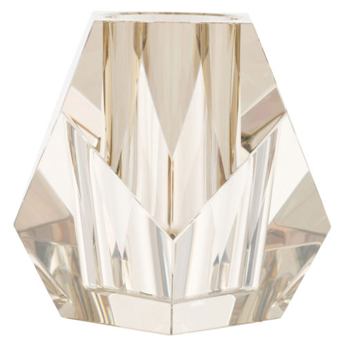 With an appearance akin to a diamond, this Vase’s champagne crystal creates an arresting blend of elements and colors. The facets, sharp corners, and edges of the vase are softened by its contents