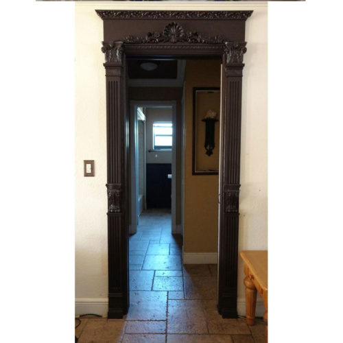 door trim with carved wood capitals