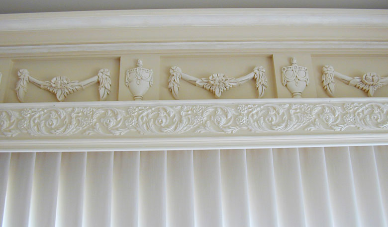 trim featuring carved wood urns and swags