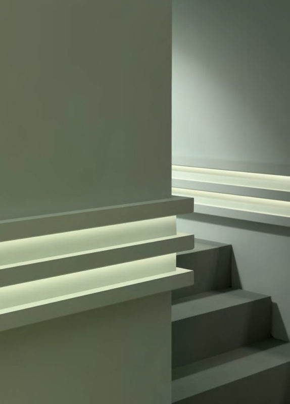 cool wall molding ideas; This creative combination of molding for indirect lighting is assembled to create a striking modern wall treatment; modern decor inspiration