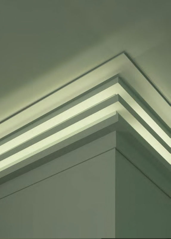 This creative combination of molding for indirect lighting is assembled to create a modern crown molding treatment. Two of the moldings for indirect lighting are installed on the wall and one on the ceiling; modern lighting and crown molding ideas