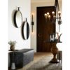 beautiful entryway with natural earth-tone hues and dark iron accents.