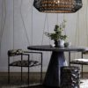 Elegant and sophisticated dining table with natural materials. Modern pedestal style dining table with etched rim adds texture and is eye catching. Unique chandelier in natural rattan with earthy tones.