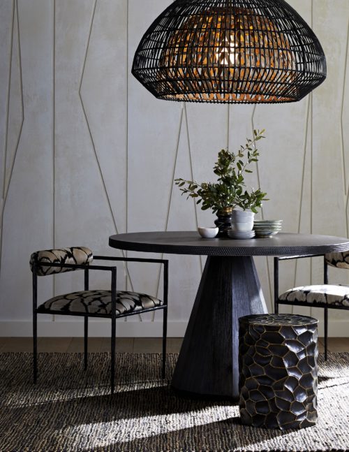 Elegant and sophisticated dining table with natural materials. Modern pedestal style dining table with etched rim adds texture and is eye catching. Unique chandelier in natural rattan with earthy tones.