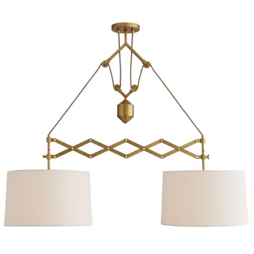 Tension and balance are dynamic qualities this dual pendant light employs. staged over a long dining table or a kitchen island where the linear form of the design can shine. Finished in antique brass.