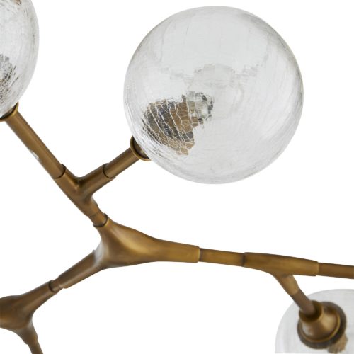 Strikingly modern, this chandelier makes a big impact in any space. Dozens of uniquely made steel pipe joints are connected to create the nebulous branches that hold the 16 lamps. Each lamp is fitted with a crackledglass globe that’s cut at the top to cast unfiltered light upward.