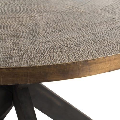 This 60" dining table is made of solid wood. The crisscross base has been stained a deep espresso color, while the top is clad in antique brass and textured to resemble a luxurious textile.Perfect as a dining table for six or a striking entry piece.